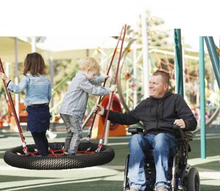 father with kids on playground
