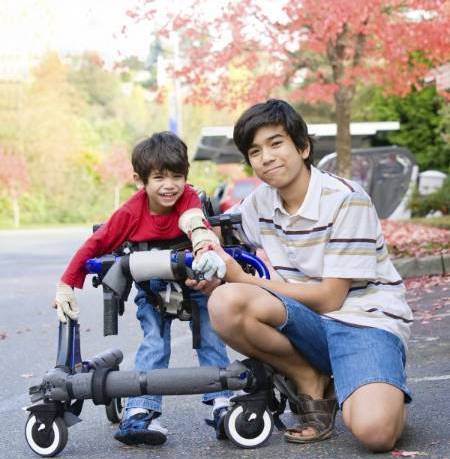 brothers, one with assistive technology