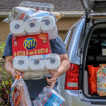person overloaded with groceries