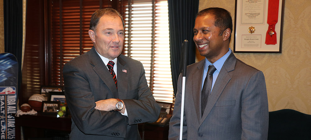 Sachin Pavithran with Utah Governor Gary Herbert