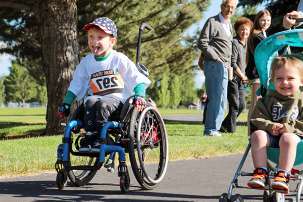 Child racing in wheelchair