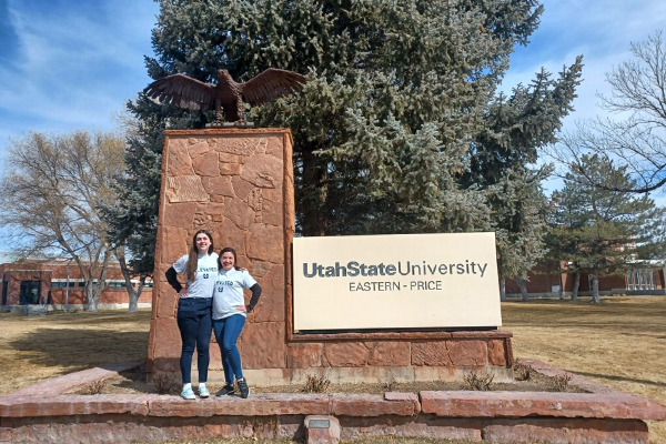 portrait in front of USU-Price sign