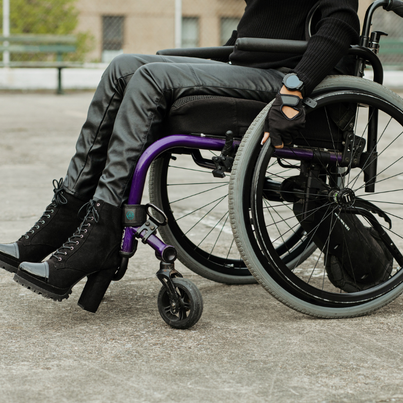legs and feet of a woman in a wheelchair and cute boots