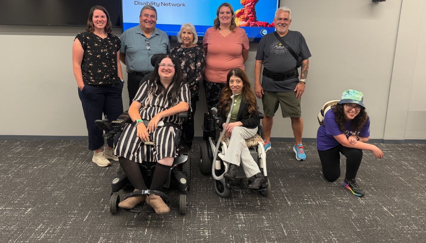 Some members of the Disability Research Advisory Board stand together at a conference.