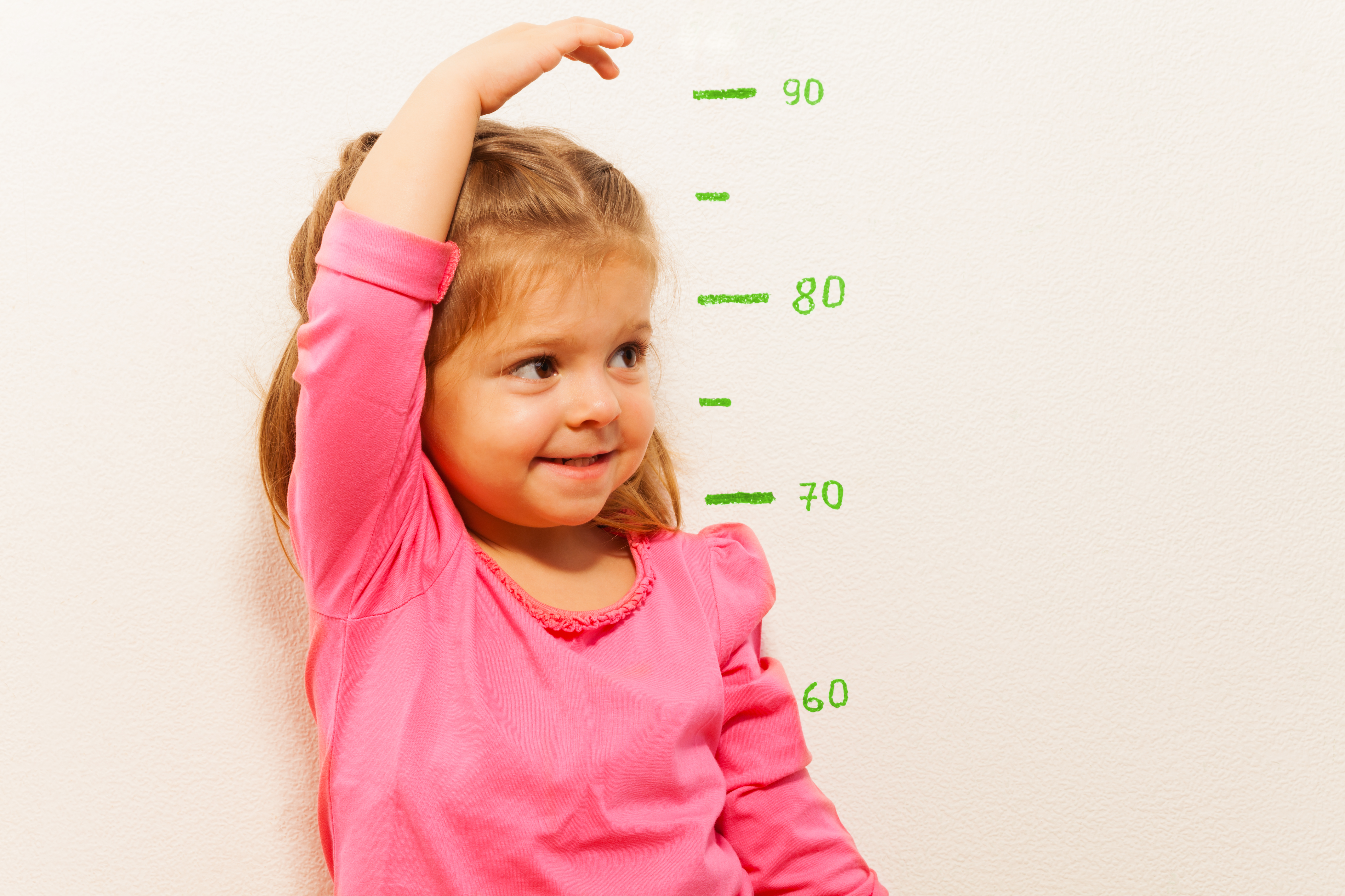 Child measuring her height